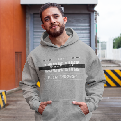 I don't look like what I've been through™ Hooded Sweatshirt